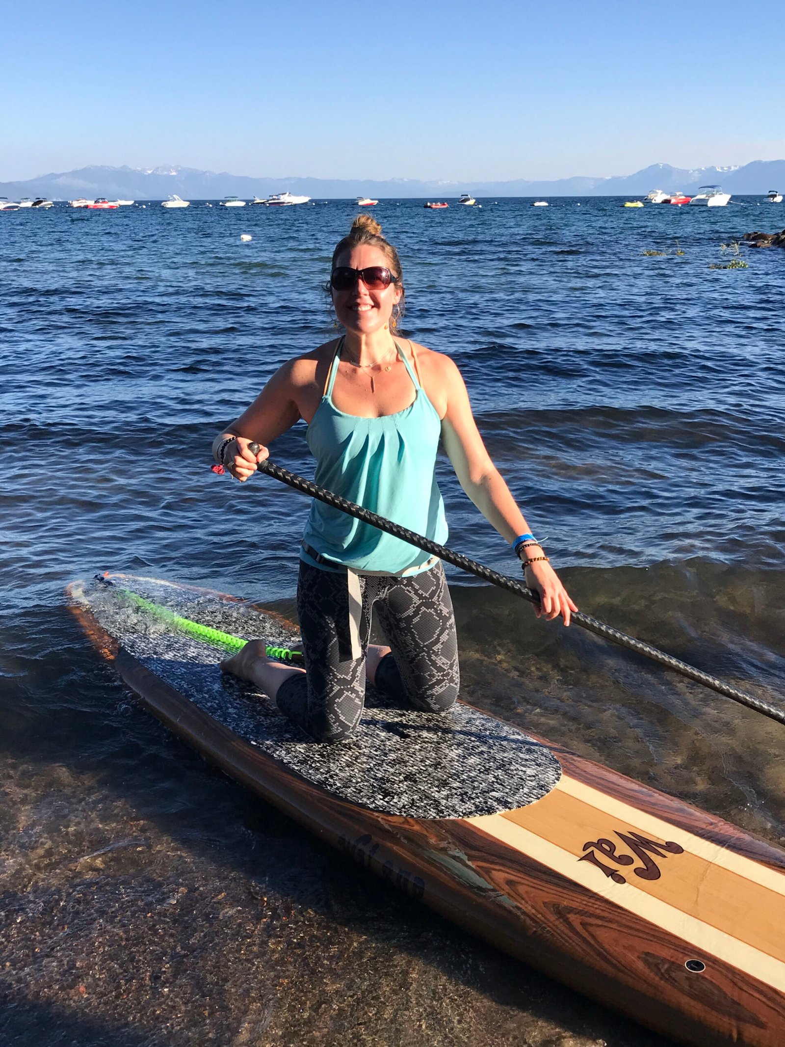 Emily Logsdon kayaking on a lake